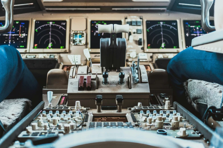 pilots at the controls in an airplane