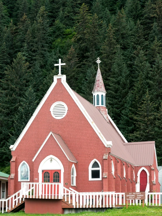 red and white church with white picket fence