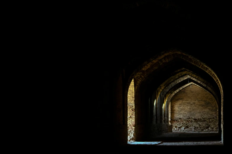 an arch lit up by light coming from it