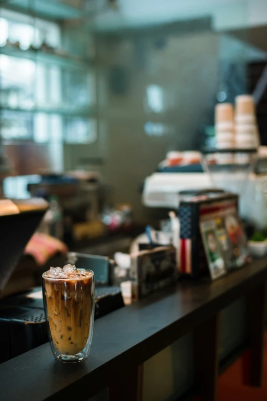 a counter top with a drink on it