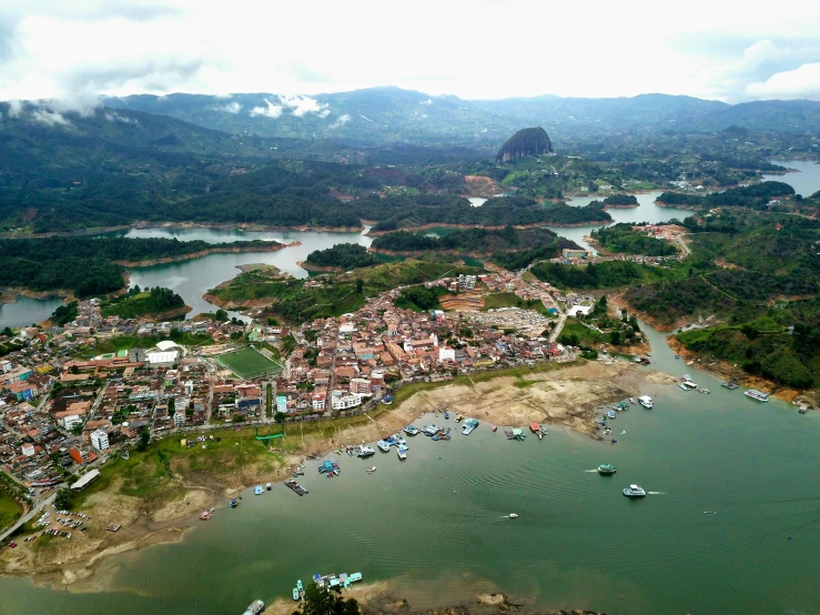 an aerial s of a village with small boats