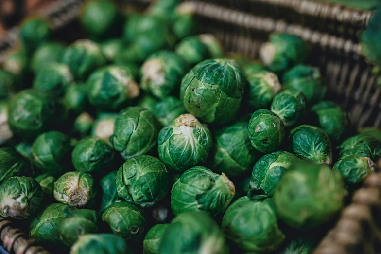 brussels sprouts are in a woven basket