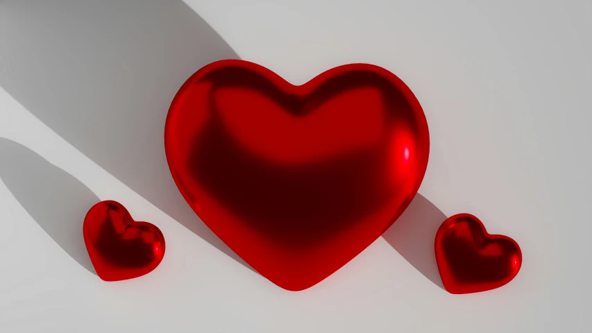 red heart shaped objects arranged on a white surface