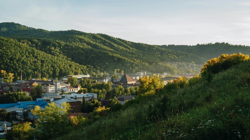 the town is nestled among the hills and trees