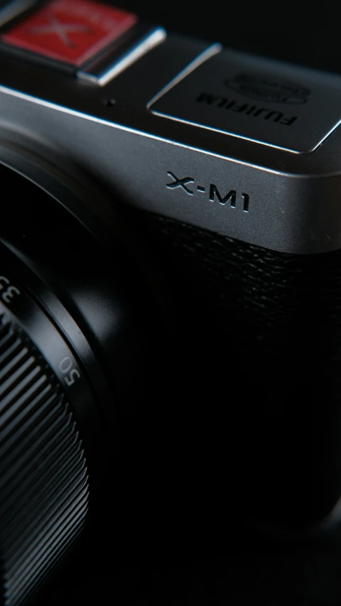 a camera with black body and lens cap on it