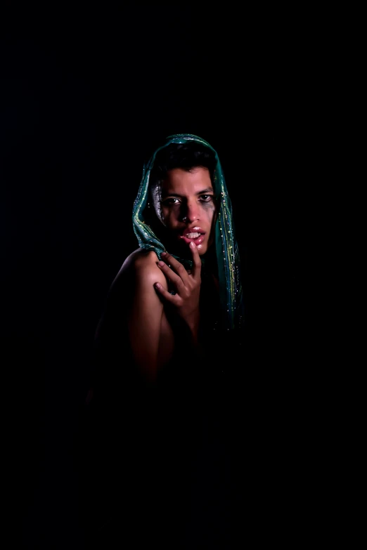 a woman with green hair in the dark