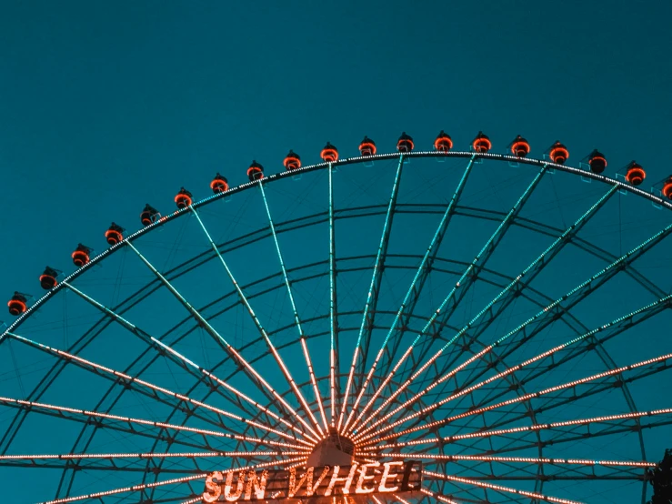 the sky wheel at the fun park lit up for christmas