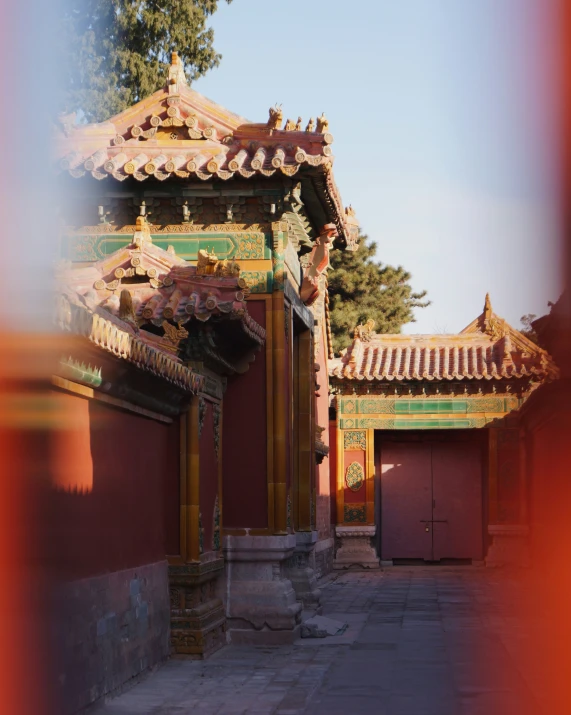 a long narrow courtyard with tall buildings in the background