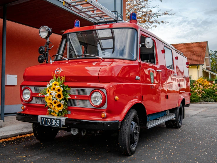 an old style fire truck parked on the street