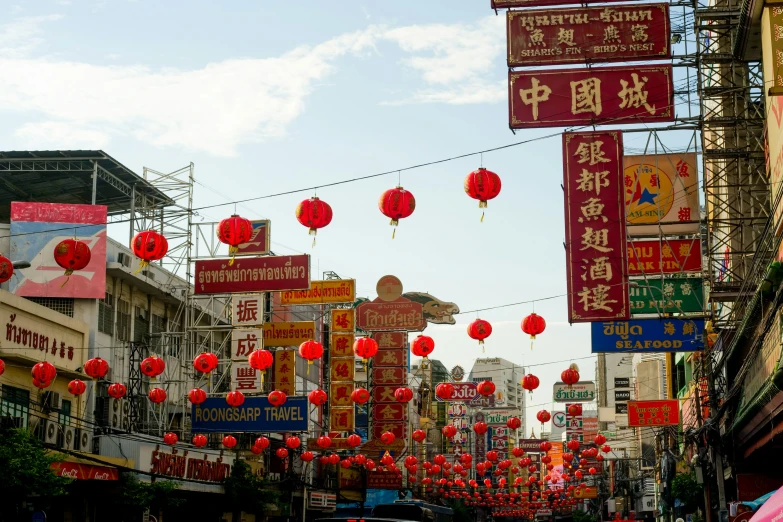 chinese lanterns in a foreign city are strung with red paper