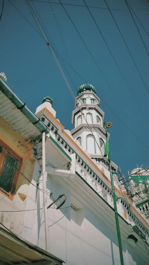 a tall white tower towering over a city