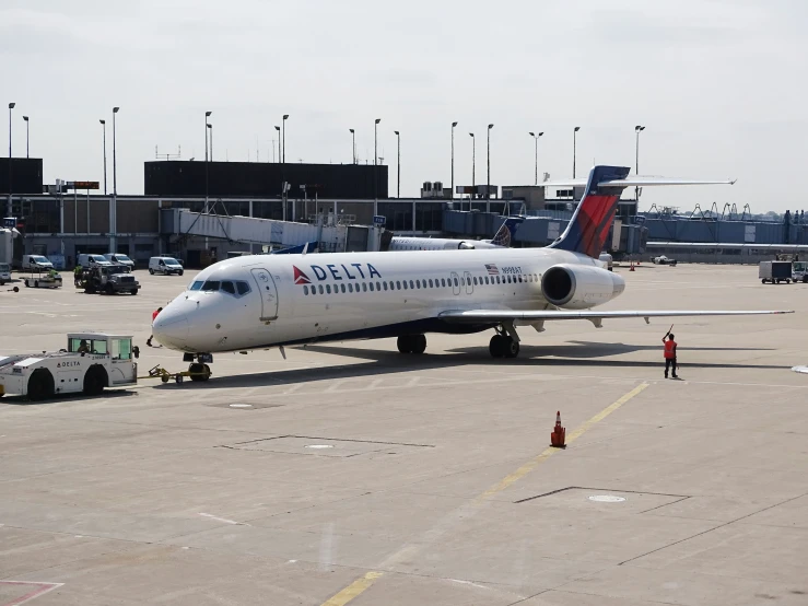 there is a plane on the runway in the airport