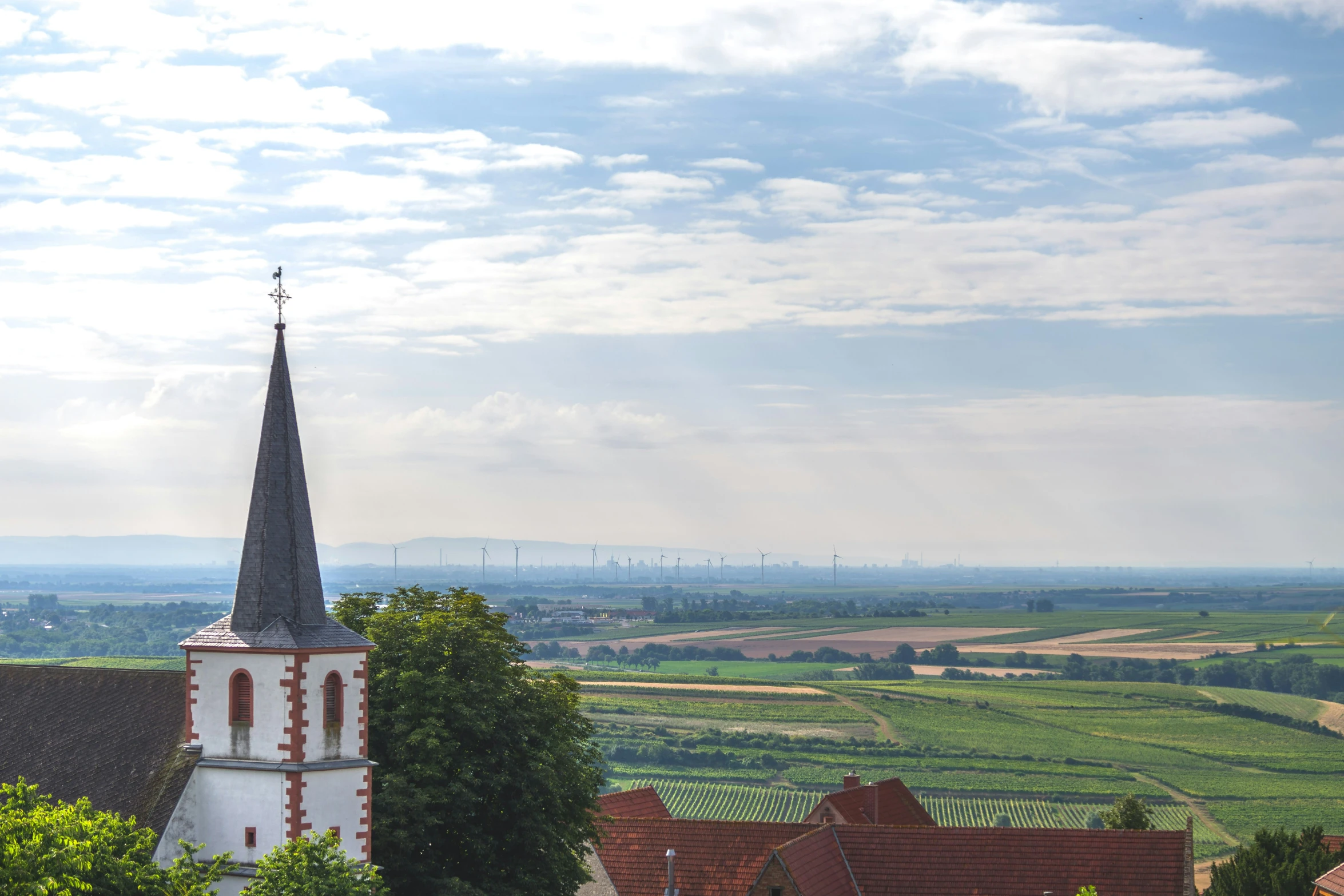 an old church steeple against a blue sky