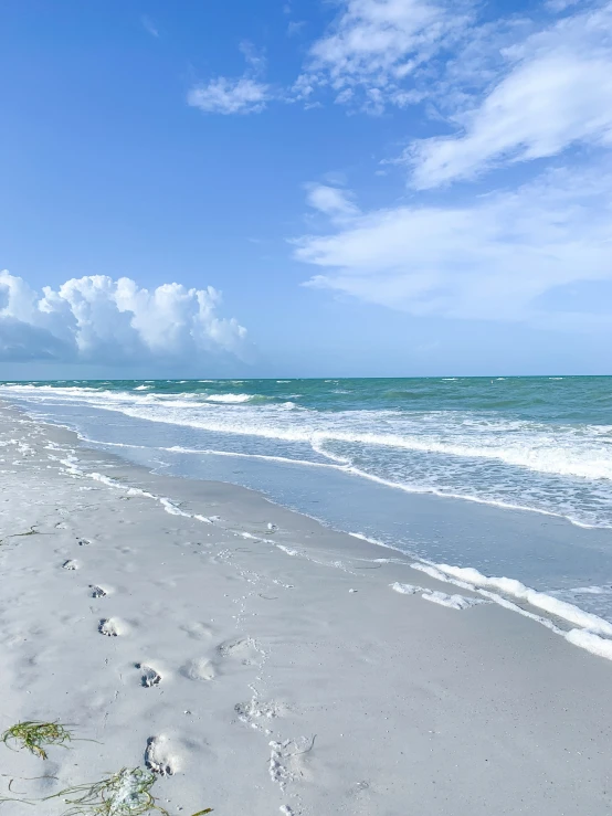 a beach on the ocean and a very bright sky