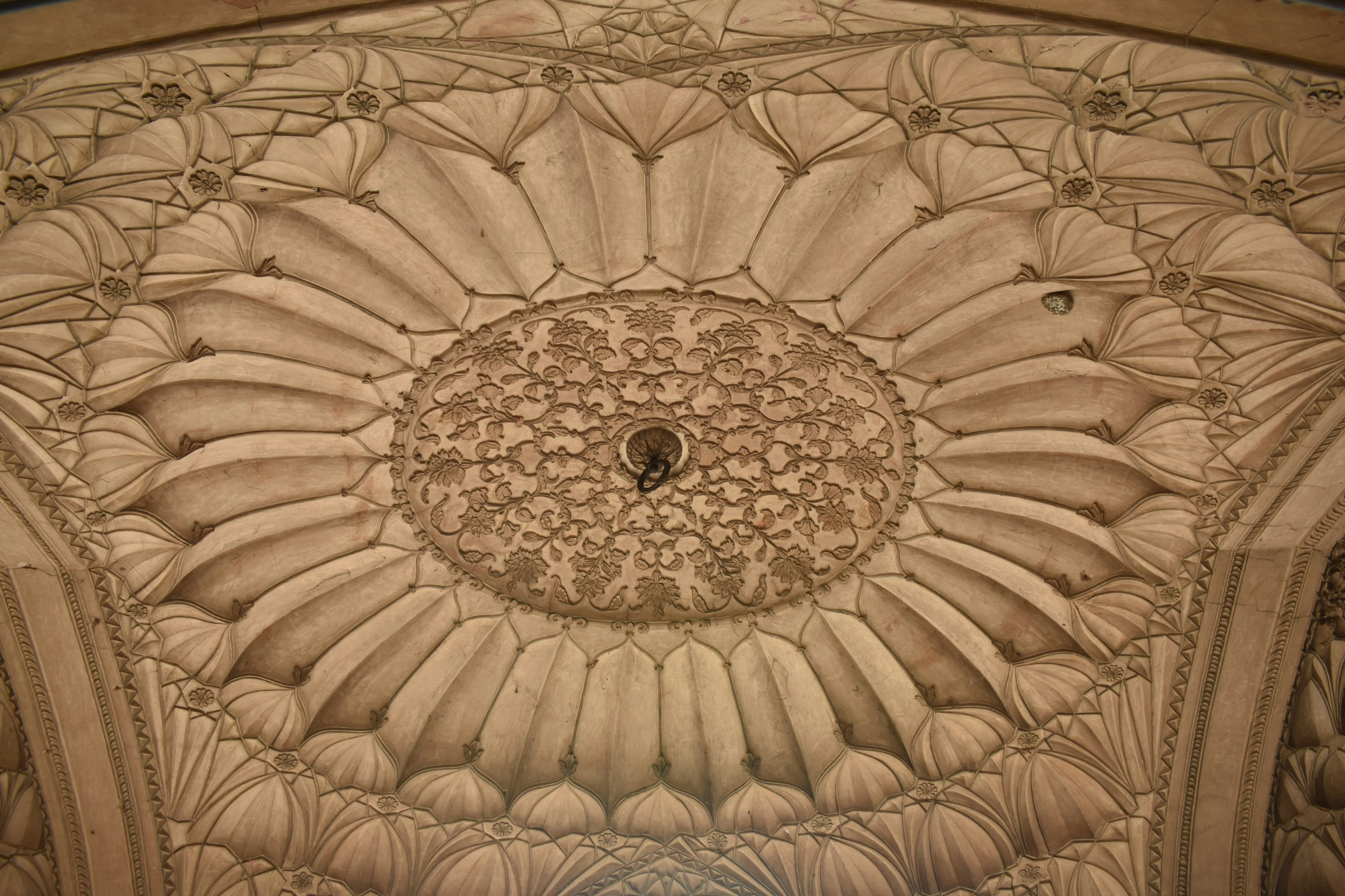 an ornate design is seen on the ceiling of a building