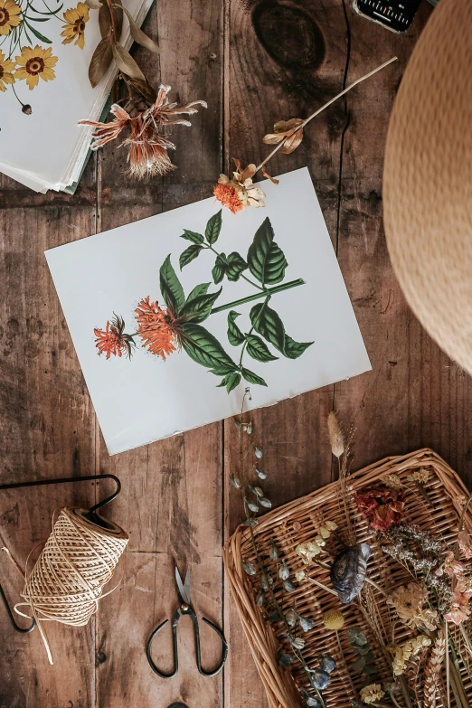 flowers on paper sitting on top of an old table