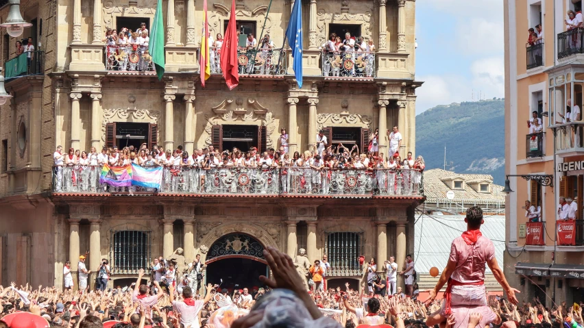 a person riding a horse in front of a large group of people