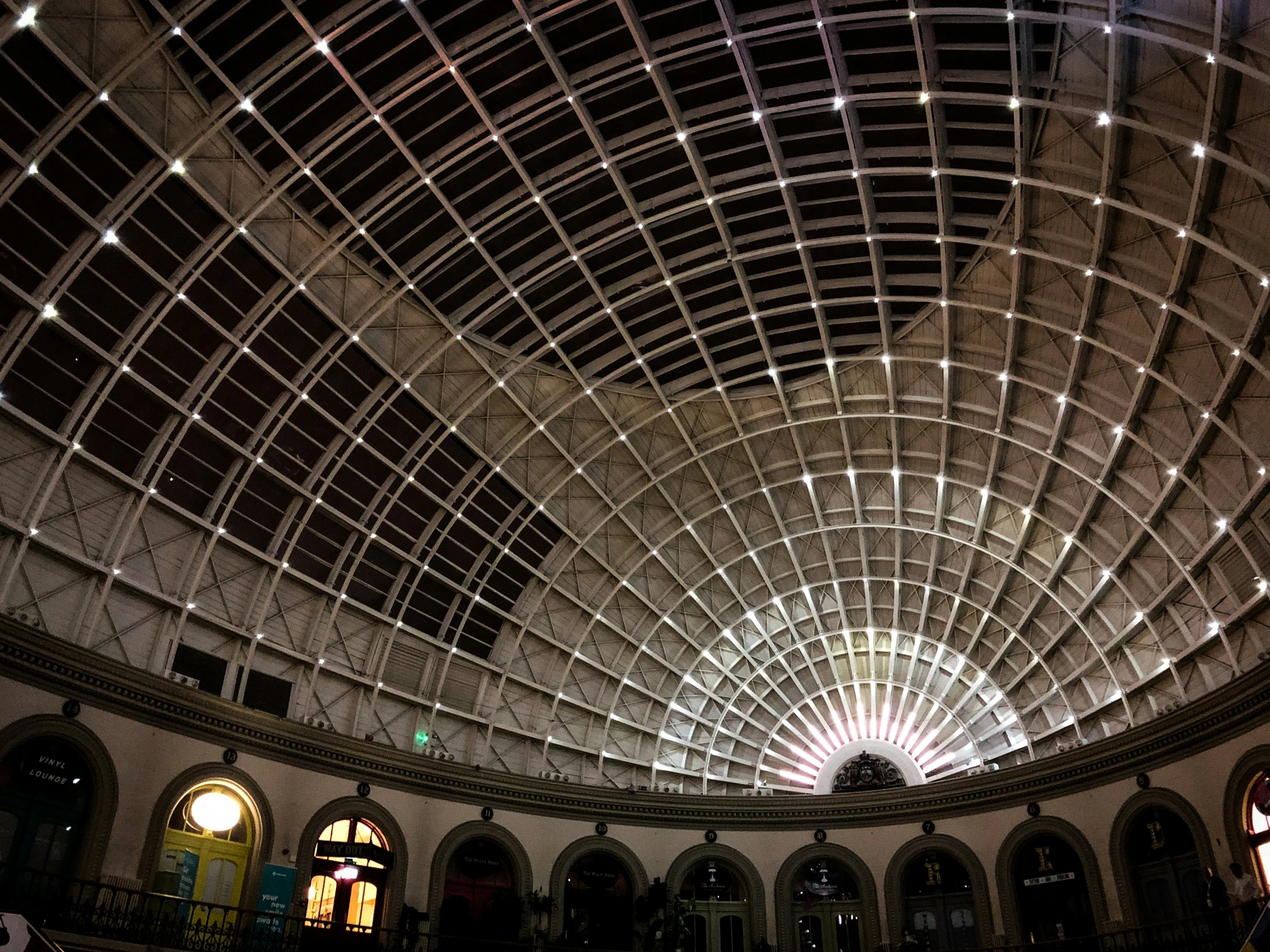 the ceiling of a hall has an intricate pattern