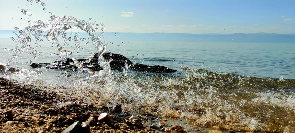 the surfers are surfing in the water near the shore