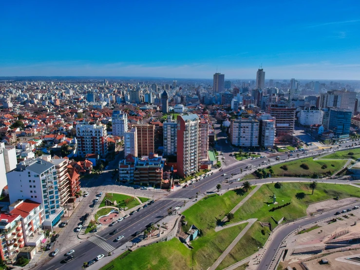 an aerial view of a city street with high rise buildings and other modern buildings