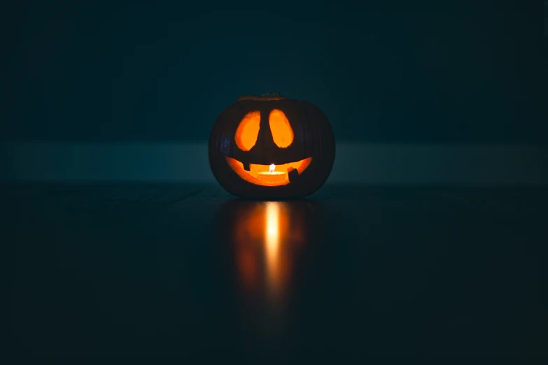 a carved jack o lantern sits on a table