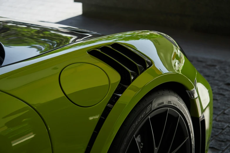 the front tire trim on a lime green sports car