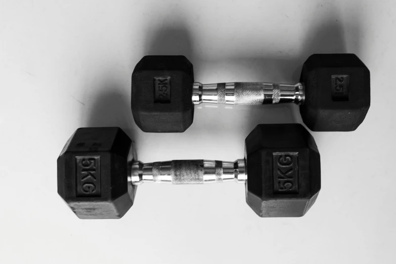 a black and white po of some dumbbells
