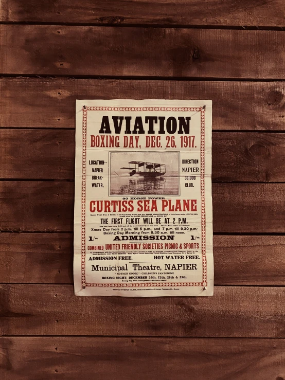 a flyer posted against a wooden wall advertising air and coffee