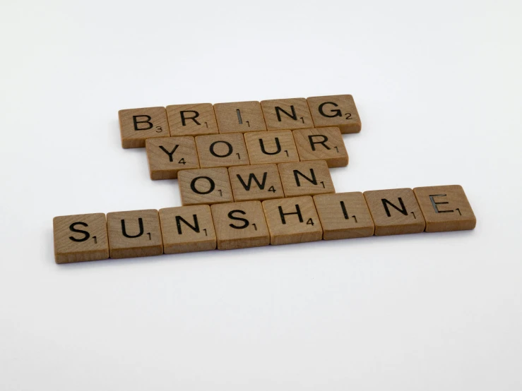 some type of scrabble that has been arranged to make the words bring your own sunshine