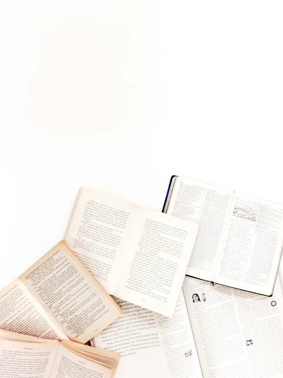 a bunch of books are stacked together on a table