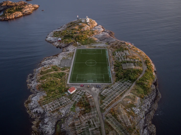 an island with soccer fields is shown in this aerial po