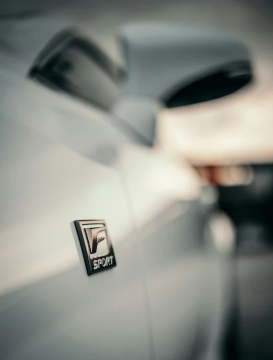 a car is shown with the emblem and the word sport