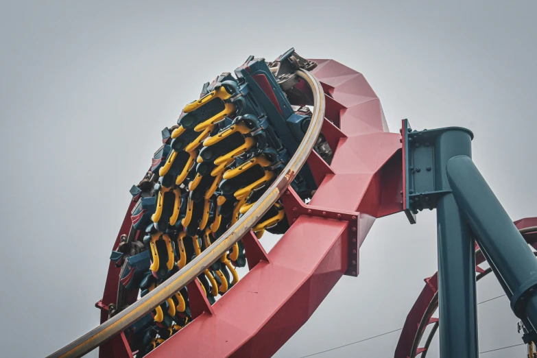 a roller coaster riding down a track on an amut park