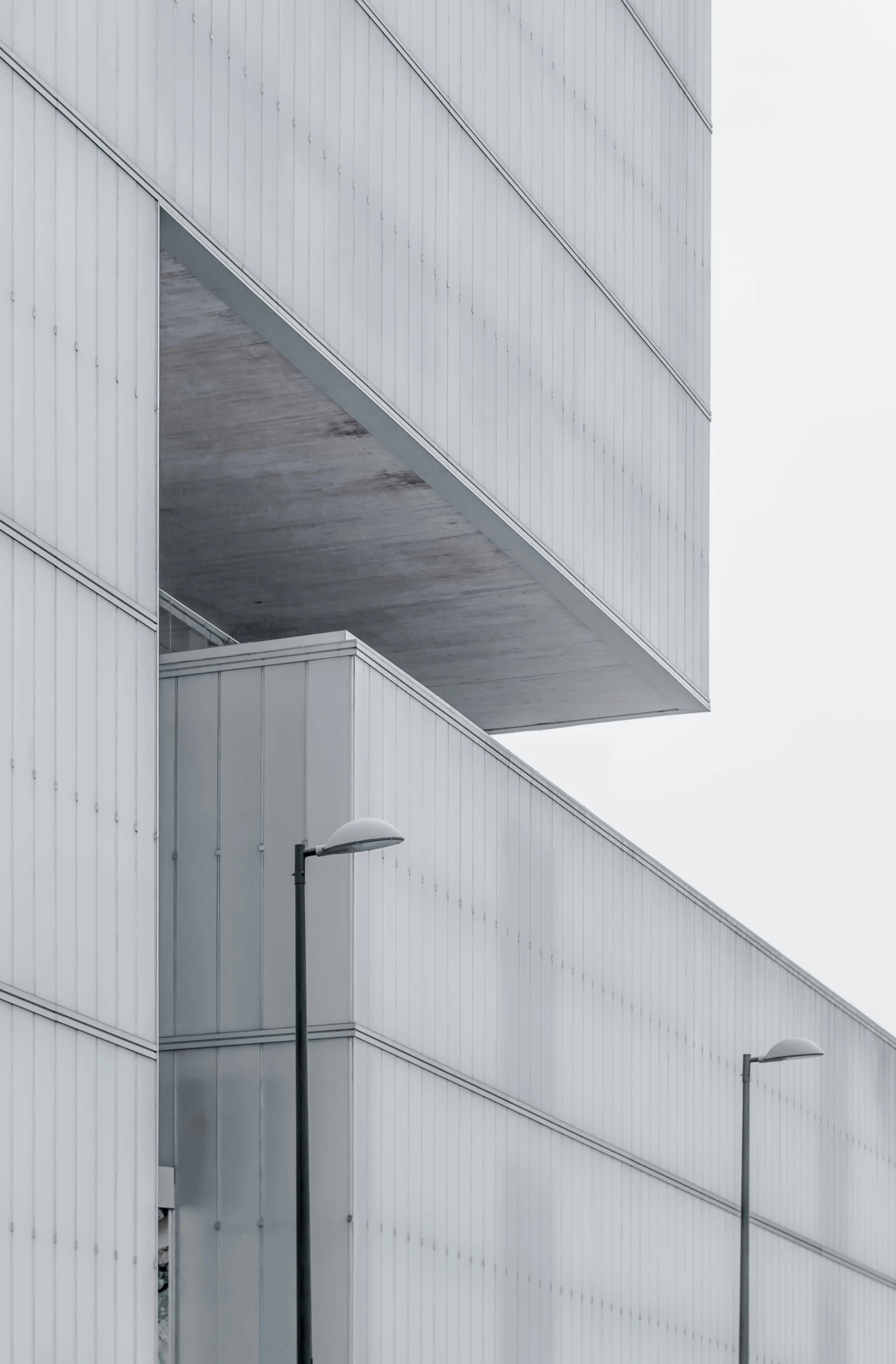 white and gray architecture with a long metal railing