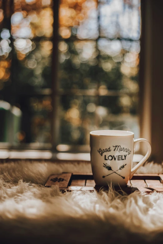 a cup of tea sits on a wooden table