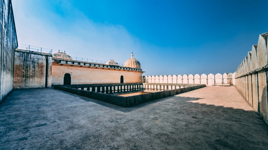 there is a building in the background that has multiple rows of windows and arches