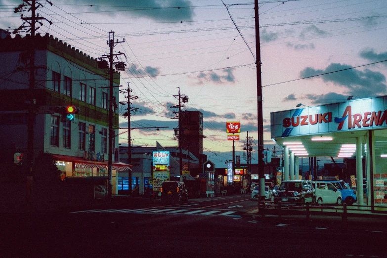 a business and street at dusk with an orange glow