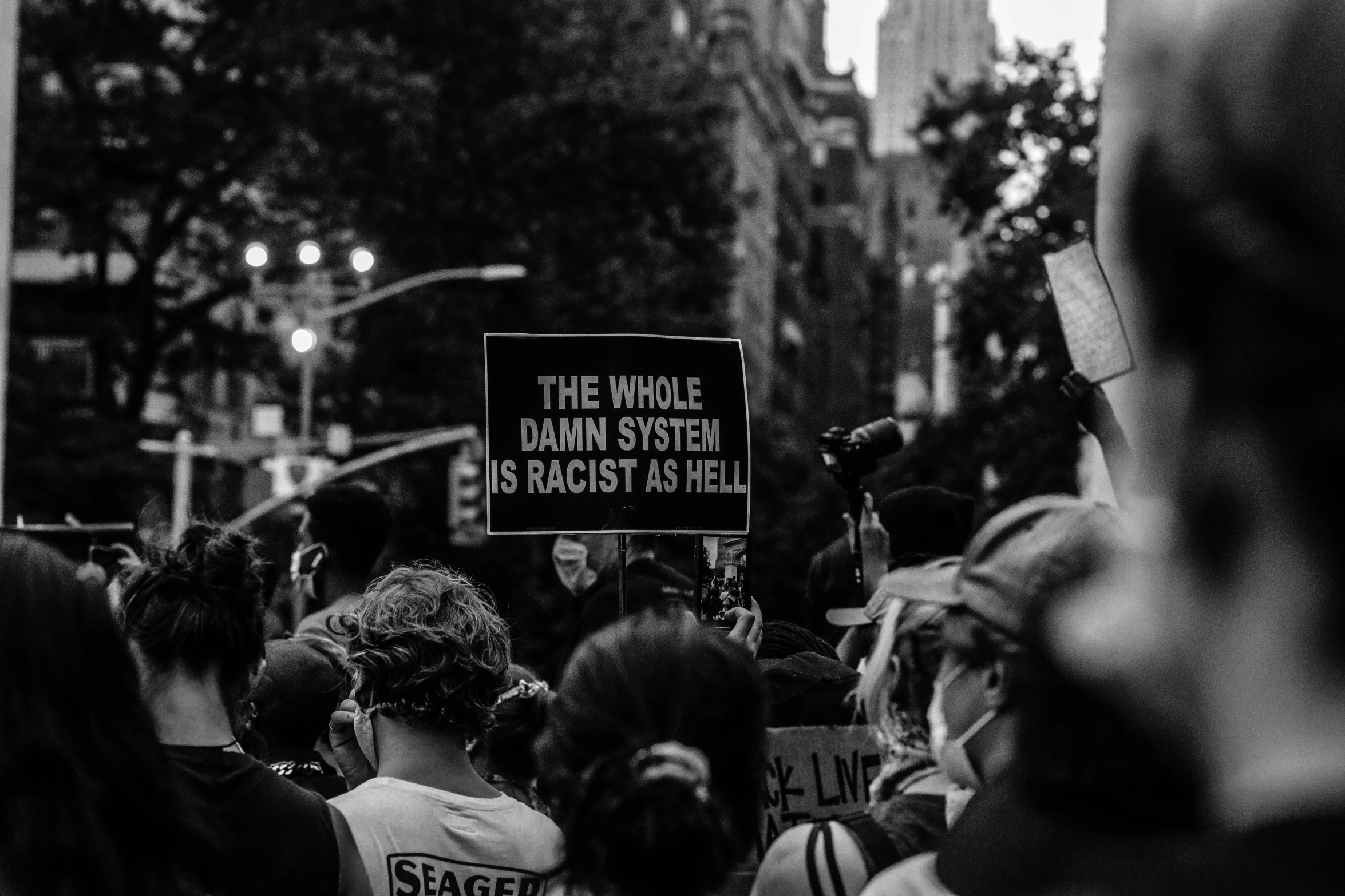 a crowd of people are gathered outside a building