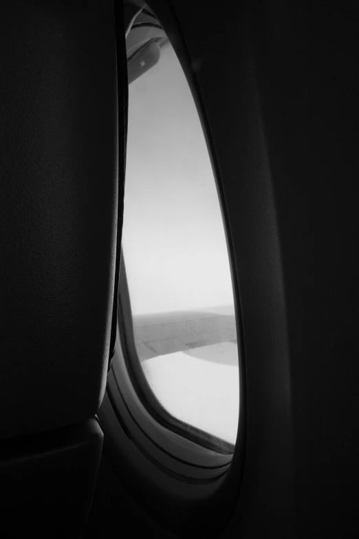 the view from an airplane window over a plane wing