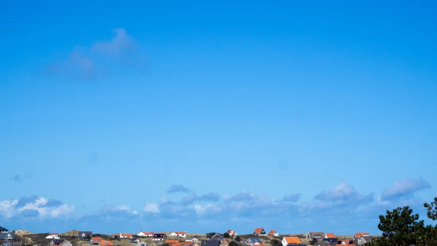 a city with a tower with buildings next to it