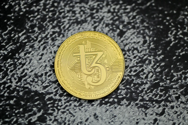 a bitcoin is shown on a surface