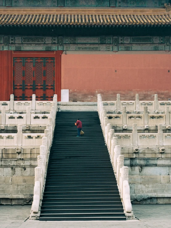 a person stands at the bottom of a set of stairs in a chinese style