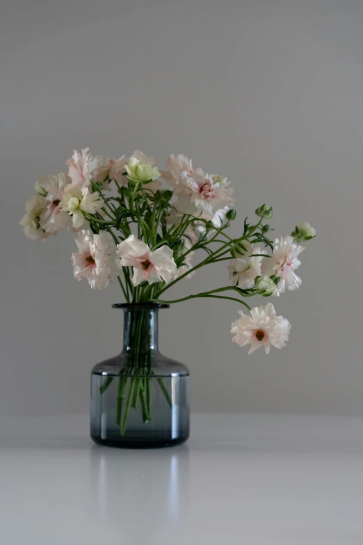 a vase with some flowers in it on a table