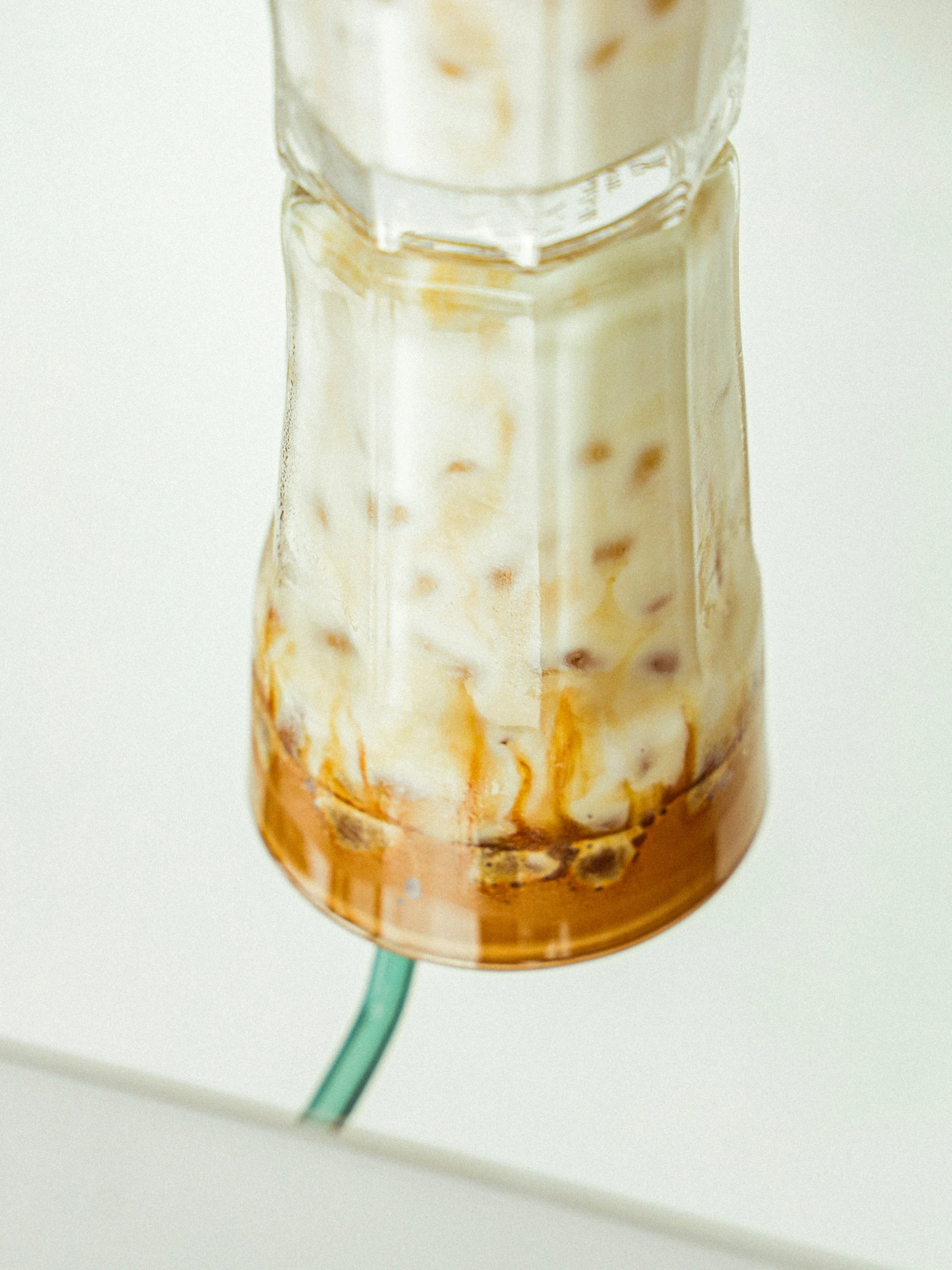 an empty glass jar holding food on a kitchen counter