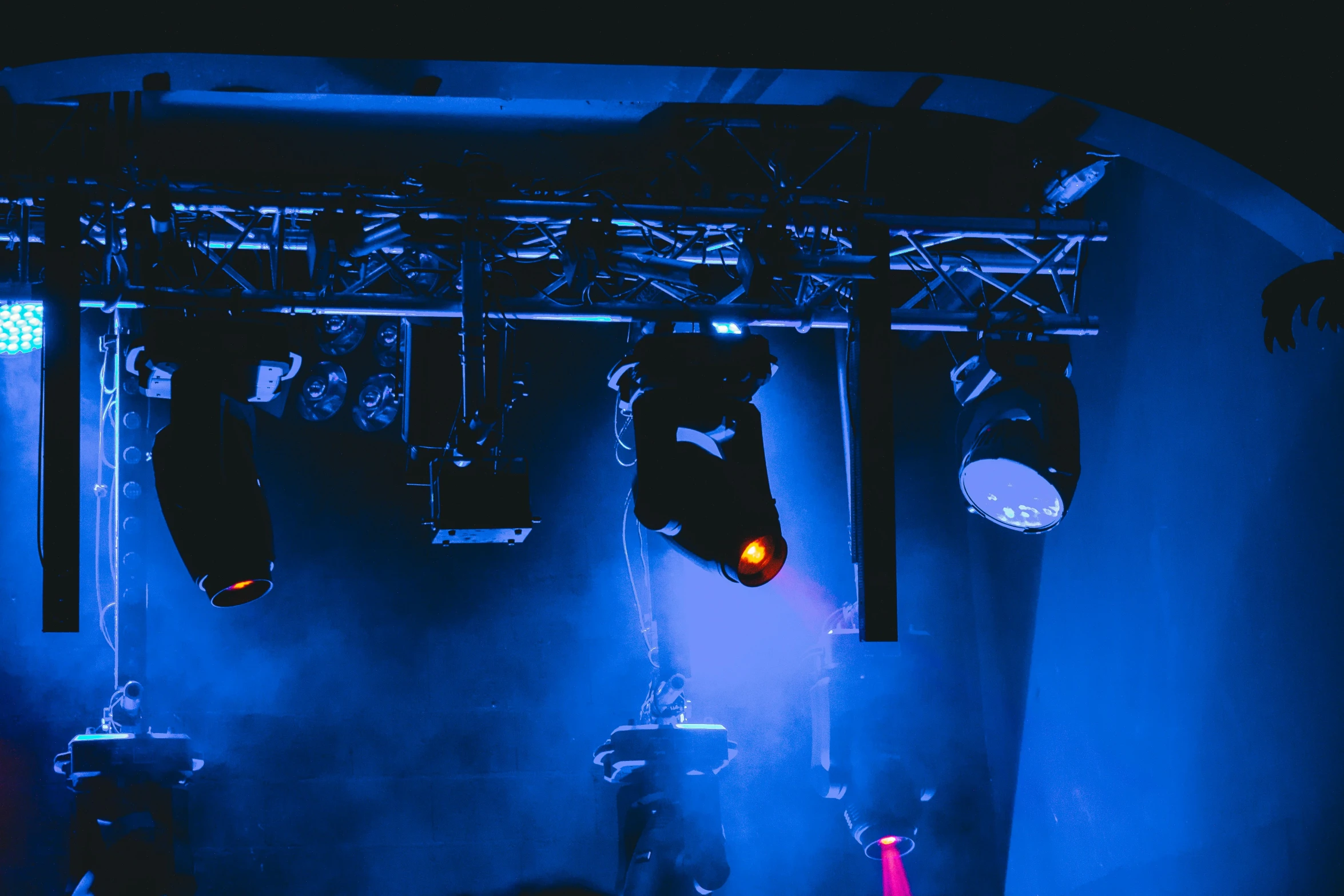 blue lighting in a theatre with people watching