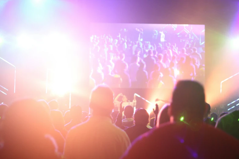 a stage full of people at a festival