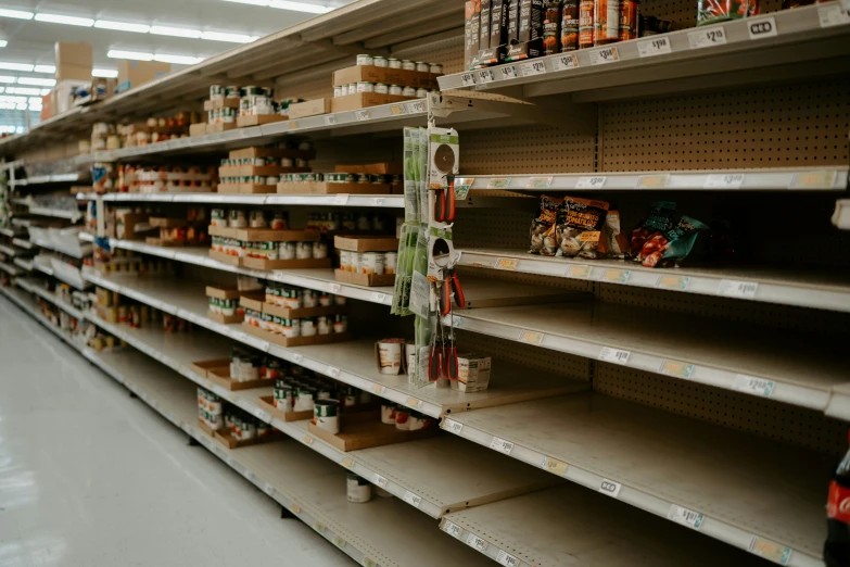 shelves in a grocery store that are stocked with food