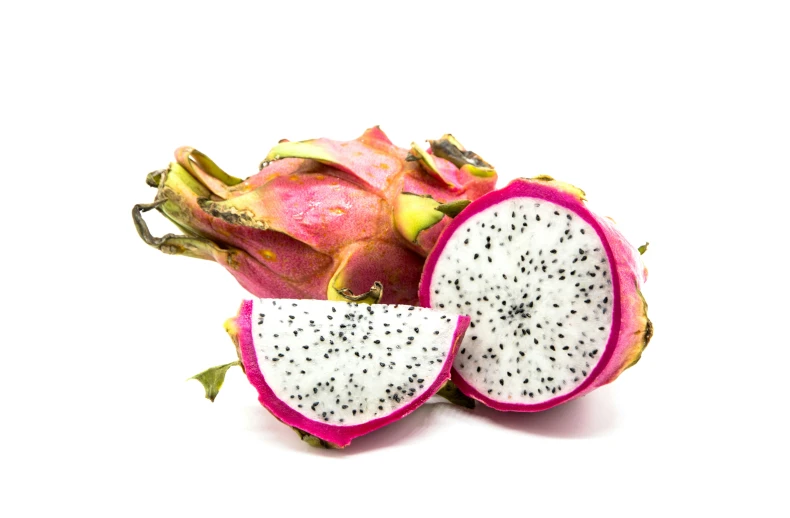 dragon fruit cut into pieces with one slice open and half still attached