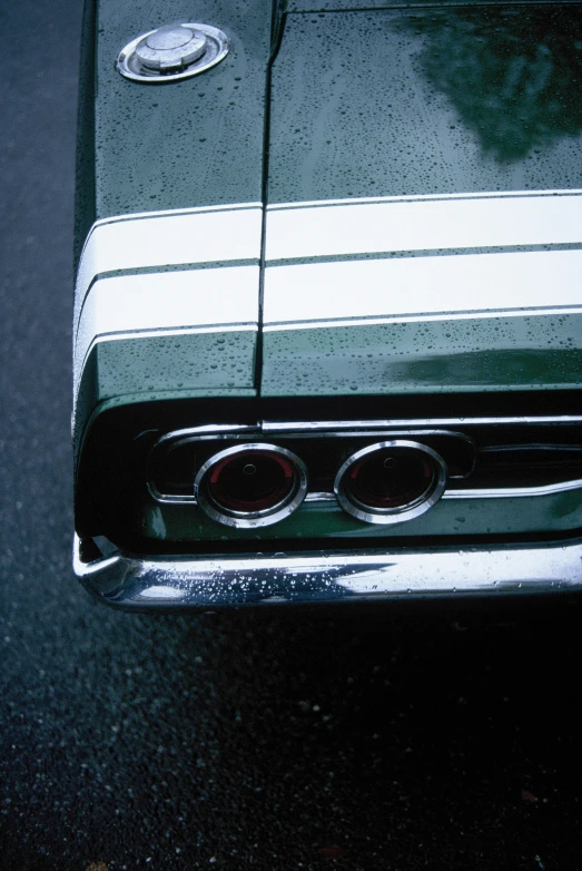 the emblem on an older car on a dark background