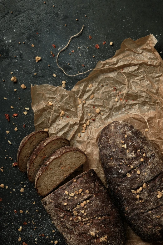 a cut loaf of bread is sitting on a piece of paper